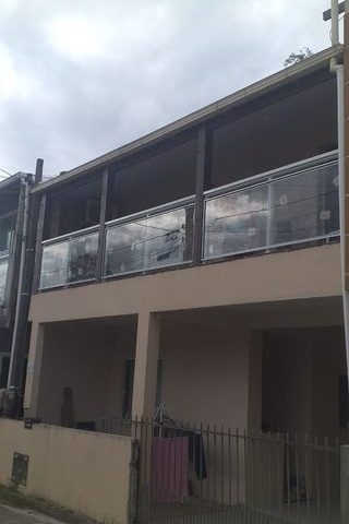 Sacada envidraçada em sobrado